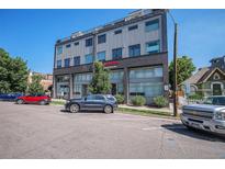 Modern office building with street parking and signage at 2831 W 25Th Ave # 3, Denver, CO 80211