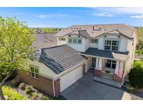 Beautiful two-story home with a well-manicured lawn and attached two-car garage at 20592 E Lake Ave, Centennial, CO 80016