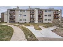 Tan multi-unit building with multiple balconies and walkways at 2740 W 86Th Ave # 186, Westminster, CO 80031