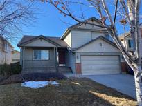 Charming two-story home with a two-car garage and covered front porch at 10067 Idalia St, Commerce City, CO 80022