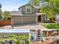 Inviting two-story home featuring a two-car garage, well-maintained lawn, and charming architectural details at 3418 Elk Ct, Broomfield, CO 80020