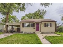 Charming single-story home with a carport, small front lawn, and purple front door at 1737 Beeler St, Aurora, CO 80010