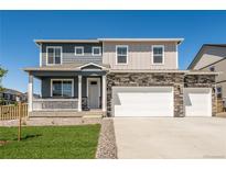 Charming two-story home with a covered porch, stone accents, and a spacious three-car garage at 4113 Marble Dr, Mead, CO 80504
