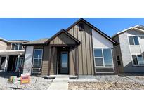 Charming single-Gathering home with a tidy front yard, showcasing its inviting entrance and modern design at 2277 Serenidad St, Brighton, CO 80601