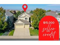 Charming two-story home with a three-car garage, mature trees, and professional landscaping at 11973 Song Bird Hills St, Parker, CO 80138