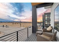 Relax on this balcony with ample seating and amazing city and mountain views at 3580 Uinta St # 17, Denver, CO 80238