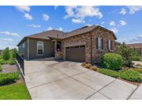 Charming single-Gathering home with a stone facade and inviting two-car attached garage at 6948 W Jewell Dr, Lakewood, CO 80227