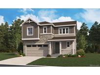 Charming two-story home featuring stone accents, a covered porch, and an attached two-car garage at 484 S Rifle St, Aurora, CO 80017