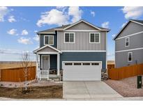Charming two-story home with a two-car garage and landscaped front yard at 17817 Dandy Brush Dr, Parker, CO 80134