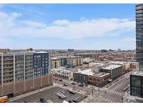 Panoramic city view featuring high-rise buildings and street-level activity at 2020 Arapahoe St # 1150, Denver, CO 80205