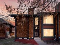 Cozy exterior view with shingle siding, trimmed windows, and a well-maintained yard, creating an inviting curb appeal at 1310 S Carson Way, Aurora, CO 80012