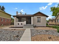 Charming single-Gathering home featuring a well-maintained front yard and inviting entryway at 1455 Hudson St, Denver, CO 80220