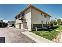 Charming two-story townhouse with a balcony, two car garage, and well-maintained lawn at 3351 S Field St # 164, Lakewood, CO 80227