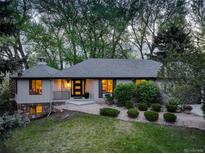 Charming single-story home with lush landscaping, manicured lawn and a welcoming front entrance at 2635 S Lamar Way, Lakewood, CO 80227