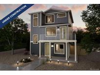 Charming two-story home with a modern design, front balcony, neutral tones and manicured landscaping at 46526 Avery Ln, Bennett, CO 80102