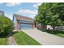 Charming single Gathering home with a long drive, mature trees, and updated siding at 13959 E 106Th Ave, Commerce City, CO 80022