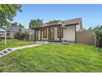 Charming home featuring a covered porch, landscaped yard, and modern architectural details at 3975 Yates St, Denver, CO 80212
