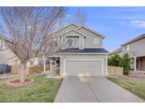 Charming two-story home with a well-maintained lawn and two car garage at 11223 Jansen St, Parker, CO 80134