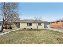 Charming ranch-style home with a well-maintained lawn and attached one car garage at 9271 Gaylord St, Thornton, CO 80229