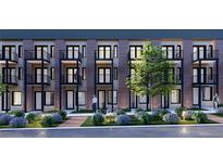 Modern apartment building featuring private balconies and landscaped garden with charming walkway at 1652 N Lafayette St # 2, Denver, CO 80218