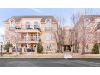 Elegant 3-story building with stone accents and balconies at 150 S Madison St # 112, Denver, CO 80209