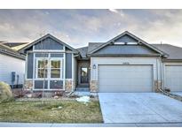 Nice two-story home with attached garage and landscaping at 6826 Sea Oats Dr, Parker, CO 80138