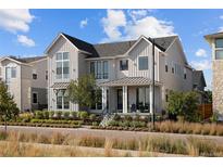 Charming two-story home with a welcoming front porch and professionally landscaped front yard, perfect for curb appeal at 6123 Chester Way, Denver, CO 80238