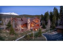 Stunning mountain home with stone accents, mature trees, and mountain views at 168 Corkscrew Dr, Breckenridge, CO 80424