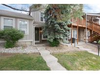 Charming townhome with a welcoming front entrance, attractive landscaping, and a well-maintained exterior at 9661 W Chatfield Ave # B, Littleton, CO 80128