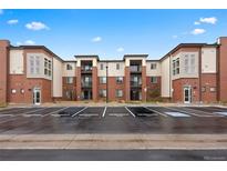 Modern building with brick and light siding and reserved parking available at 981 S Sable Blvd # 107, Aurora, CO 80012