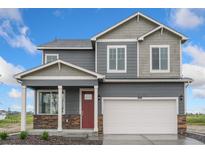 Charming two-story home features a red door, stone accents, and a spacious two-car garage at 286 Chardon Ave, Brighton, CO 80601