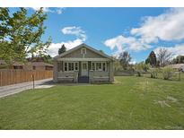 Charming home with front lawn and cozy facade at 7340 W 32Nd Ave, Wheat Ridge, CO 80033