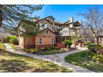 Charming condo building exterior featuring well-maintained landscaping and inviting walkways at 6001 S Yosemite St # B207, Greenwood Village, CO 80111