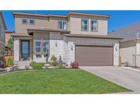 Beautiful two-story home with a well-manicured lawn and charming curb appeal at 1901 Corner Rock Ln, Castle Rock, CO 80108