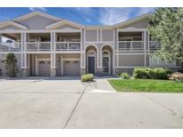 Attractive townhome featuring garages, balconies, landscaped grounds, and inviting front entrances at 4251 S Blackhawk Cir # 3E, Aurora, CO 80014