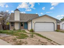 Charming single-Gathering home featuring a two-car garage and a well-maintained front yard at 8603 Barberry Pl, Parker, CO 80134