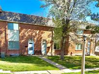 Charming brick townhomes featuring well-maintained lawns and blossoming trees at 3685 W Union Ave, Denver, CO 80236