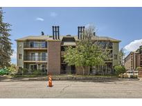 Multi-Gathering building featuring brick accents, balconies, and a well-maintained facade at 4899 S Dudley St # 20G, Littleton, CO 80123