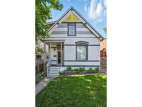 Charming two-story home with a well-manicured front yard and inviting porch at 3170 W 29Th Ave, Denver, CO 80211