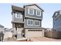 Charming two-story home featuring stone accents, a two-car garage, and a well-maintained front yard with great curb appeal at 21925 E 44Th Pl, Aurora, CO 80019