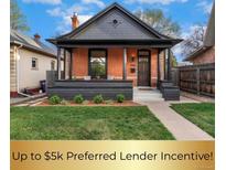 Charming brick home with a cozy front porch and well-manicured lawn at 2930 W 34Th Ave, Denver, CO 80211