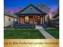 Charming brick home with a well-manicured front yard and inviting porch at 2930 W 34Th Ave, Denver, CO 80211
