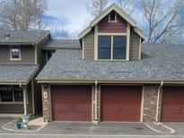 Attached garage with brick facade and two bays, situated in a well-maintained neighborhood at 10806 W Evans Ave # 5, Lakewood, CO 80227