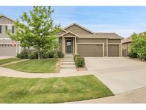 Charming single-Gathering home with a well-maintained lawn and a three car garage at 19210 E Pacific Pl, Aurora, CO 80013
