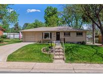Charming brick ranch home with a well-manicured lawn and inviting curb appeal at 2816 S Wolff St, Denver, CO 80236