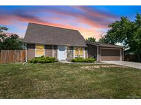 Charming single-Gathering home with well-maintained lawn and two-car garage at 6579 Ingalls St, Arvada, CO 80003