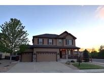 Charming two-story home with a three car garage and well-maintained landscaping at 7310 Blue Water Dr, Castle Rock, CO 80108
