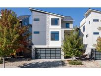 Contemporary home featuring a stylish garage door, modern siding, and well-maintained landscaping at 4349 N Meadows Dr, Castle Rock, CO 80109