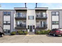 Exterior view of a multi-story condo building with balconies and parking at 1300 Golden Cir # 304, Golden, CO 80401