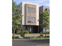 Modern two-story home featuring wood accents and a well-maintained front yard at 2736 N Clay St, Denver, CO 80211